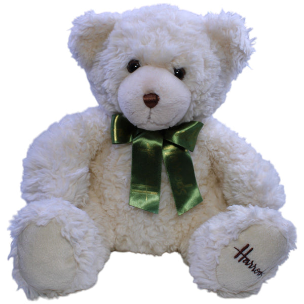Hübscher Teddybär mit grüner Schleife, sitzend
