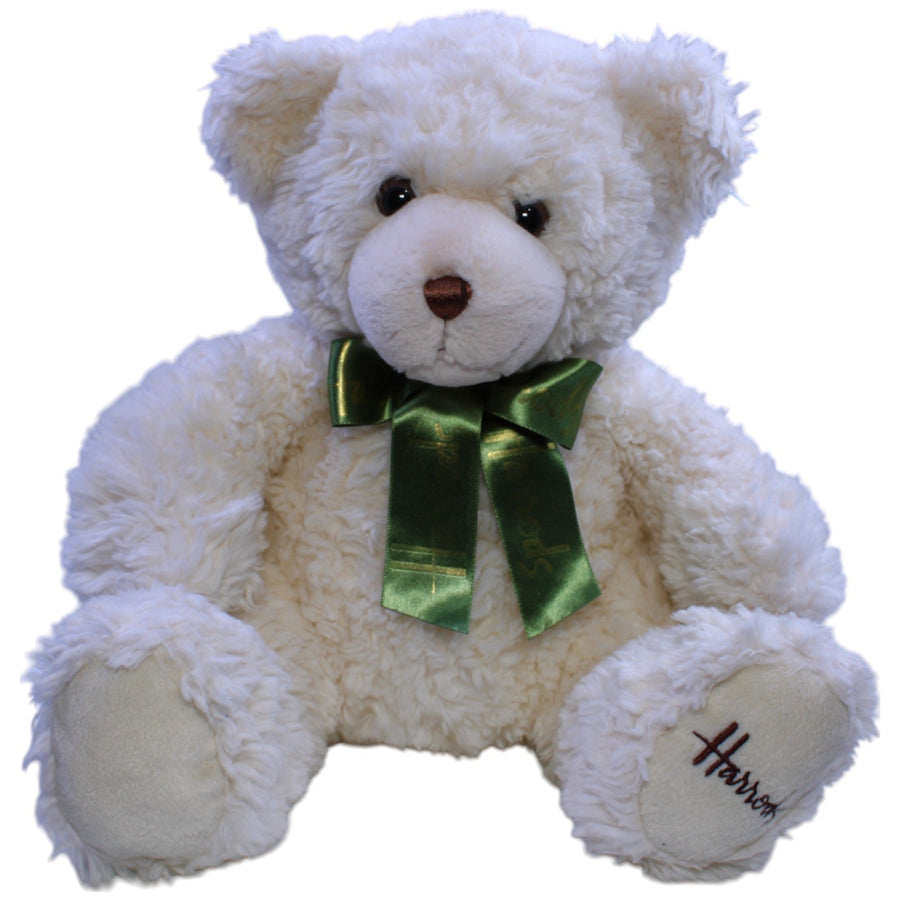 Hübscher Teddybär mit grüner Schleife, sitzend
