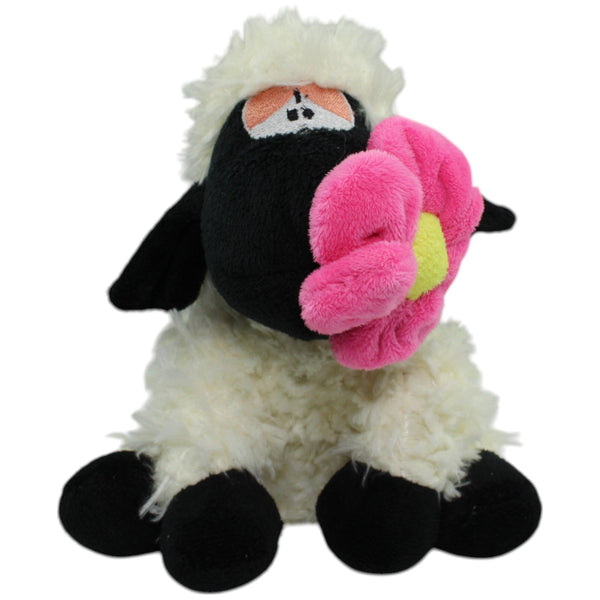 Flos Toys, sitzendes Schaf mit Blume im Mund