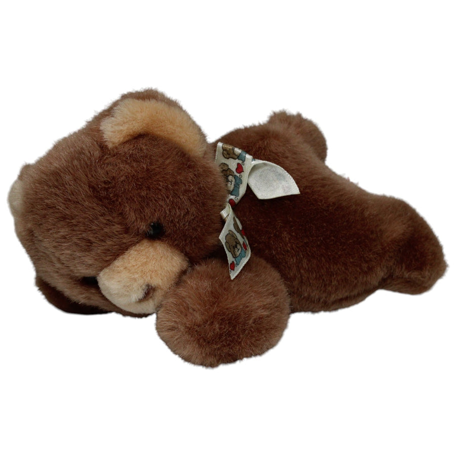 Hübscher liegender Teddybär mit Schleife