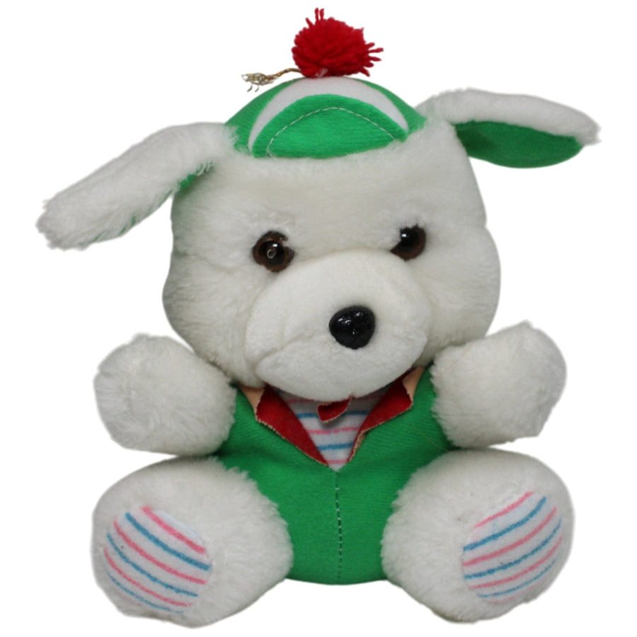 Weißer Hund mit grüner Kleidung
