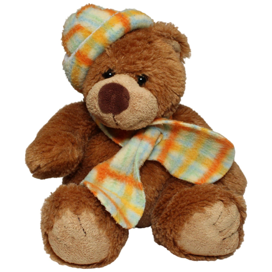 Süßer Teddybär mit karierter Mütze und Schal