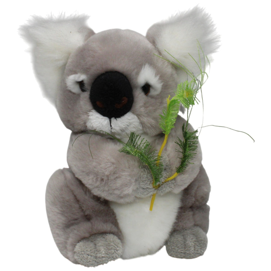 Süßer Koala mit Pflanze, sitzend