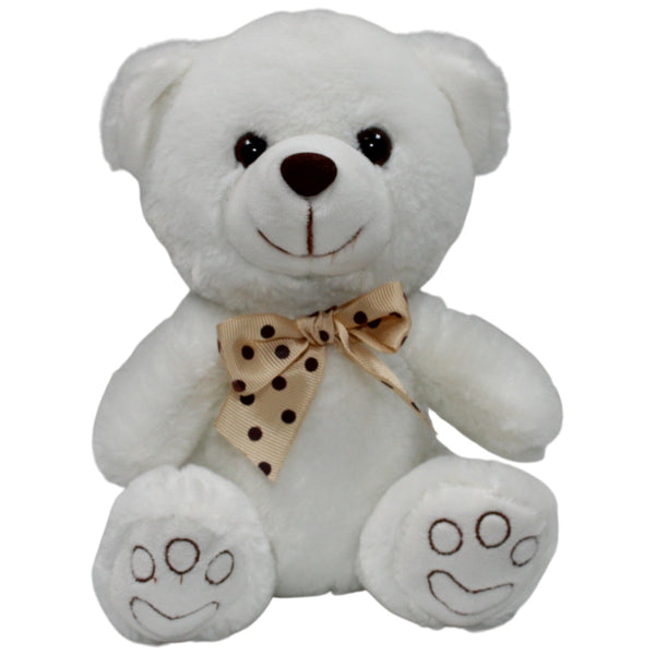 Weißer Teddybär mit gepunkteter Fliege, sitzend