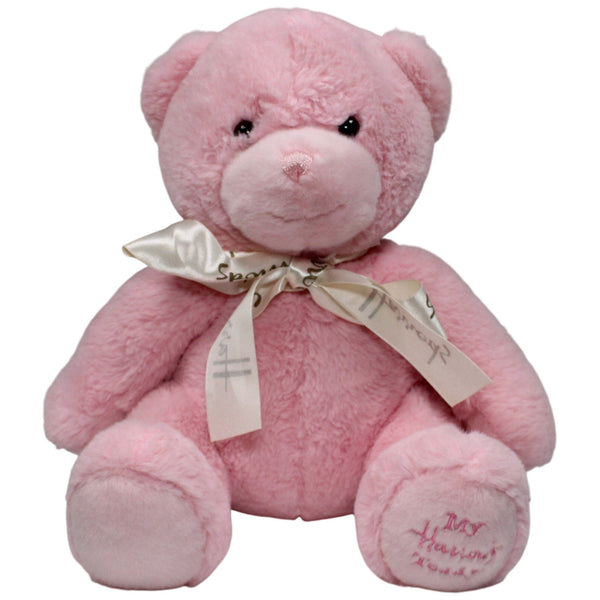 Hübscher rosa Teddybär mit Schleife, sitzend