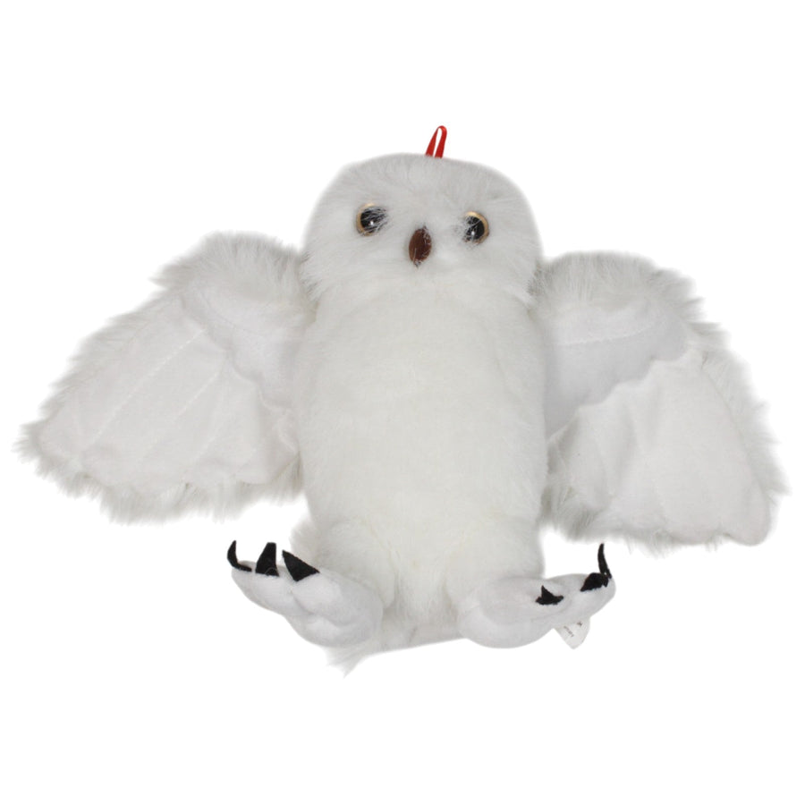 Schnneeule mit ausgebreiteten Flügeln