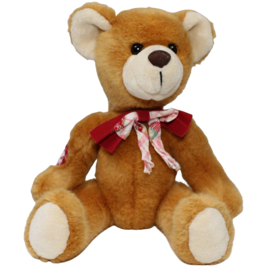 Teddy mit hübscher Schleife, sitzend