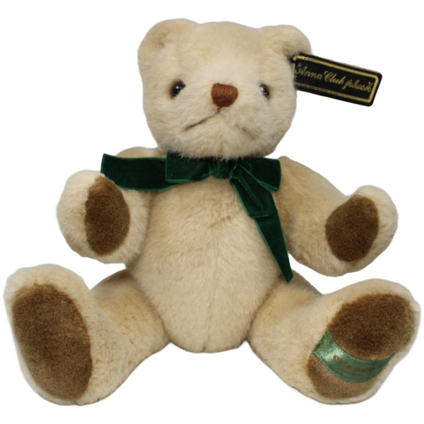 Schöner Teddybär mit grüner Schleife und beweglichen Gliedern