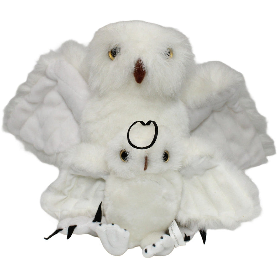 Schneeeule mit Kind, stehend