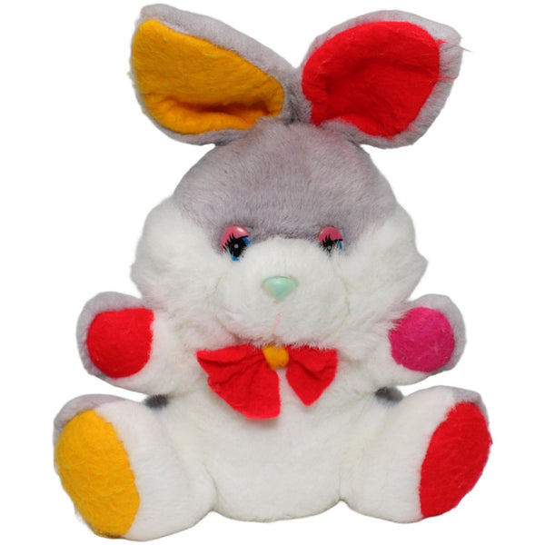 Hase mit bunten Pfoten, sitzend