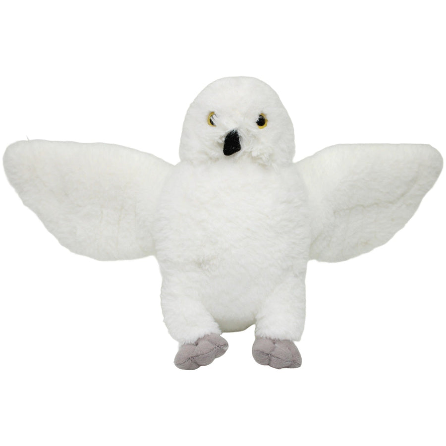 Schneeeule mit ausgebreiteten Flügeln