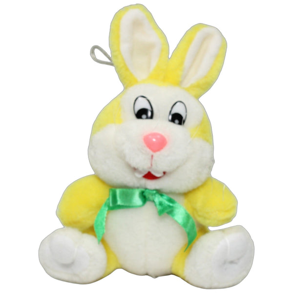 Gelber Hase mit grüner Schleife, sitzend