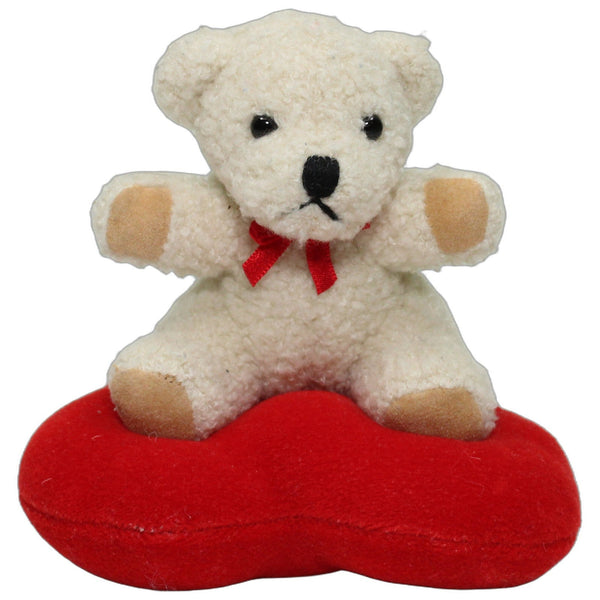 Heller Teddybär auf Herz
