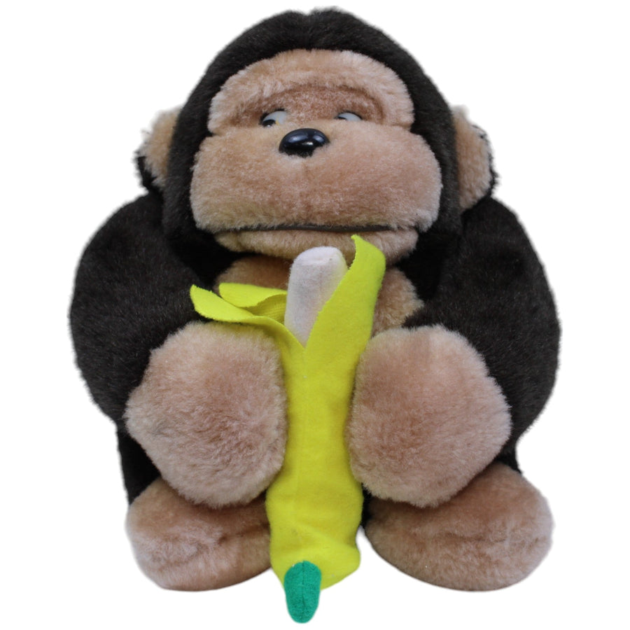 Affe mit Banane, sitzend