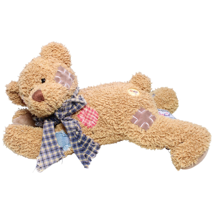 Teddy mit Patches, liegend