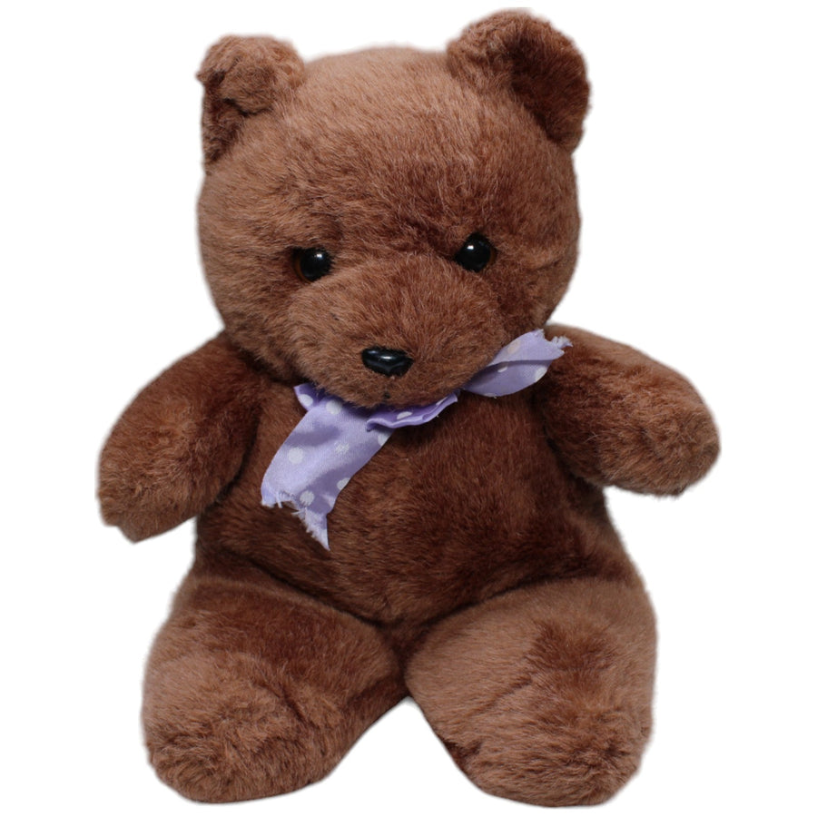 Schöner brauner Teddybär mit lila Schleife