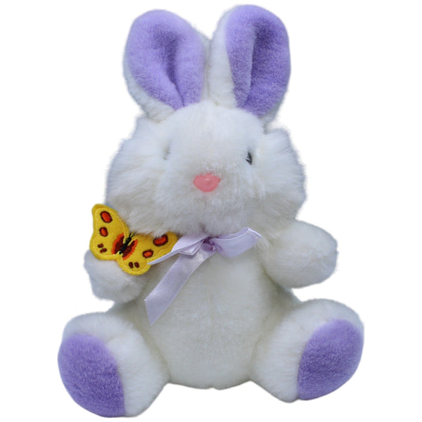 Weißer Hase mit Schmetterling und lila Ohren
