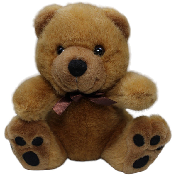 Hübscher brauner Teddybär mit Schleife, sitzend