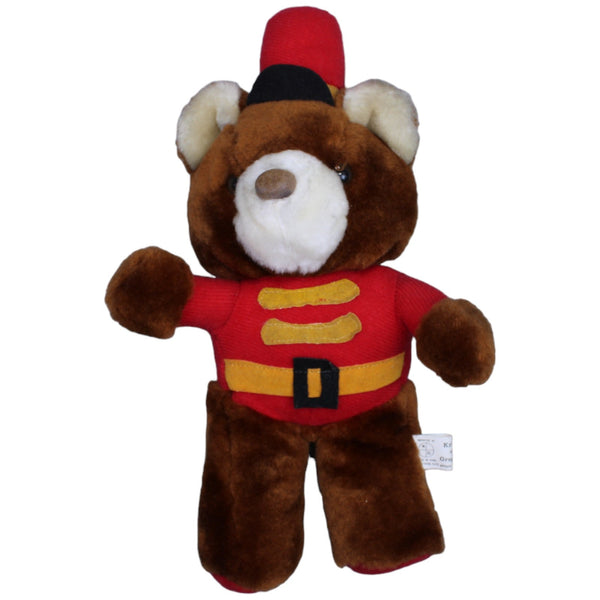 Süßer Teddybär in roter Uniform