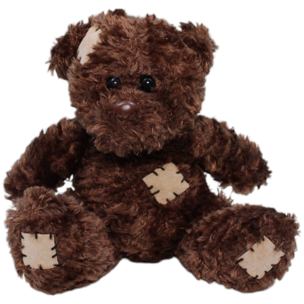 Kleiner Teddybär mit Flicken, sitzend