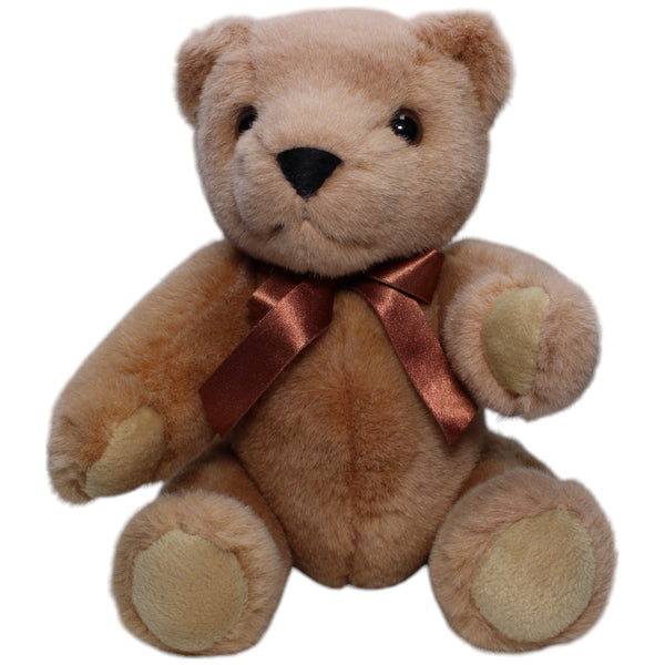 Schöner Teddybär mit beweglichen Gliedern und brauner Schleife