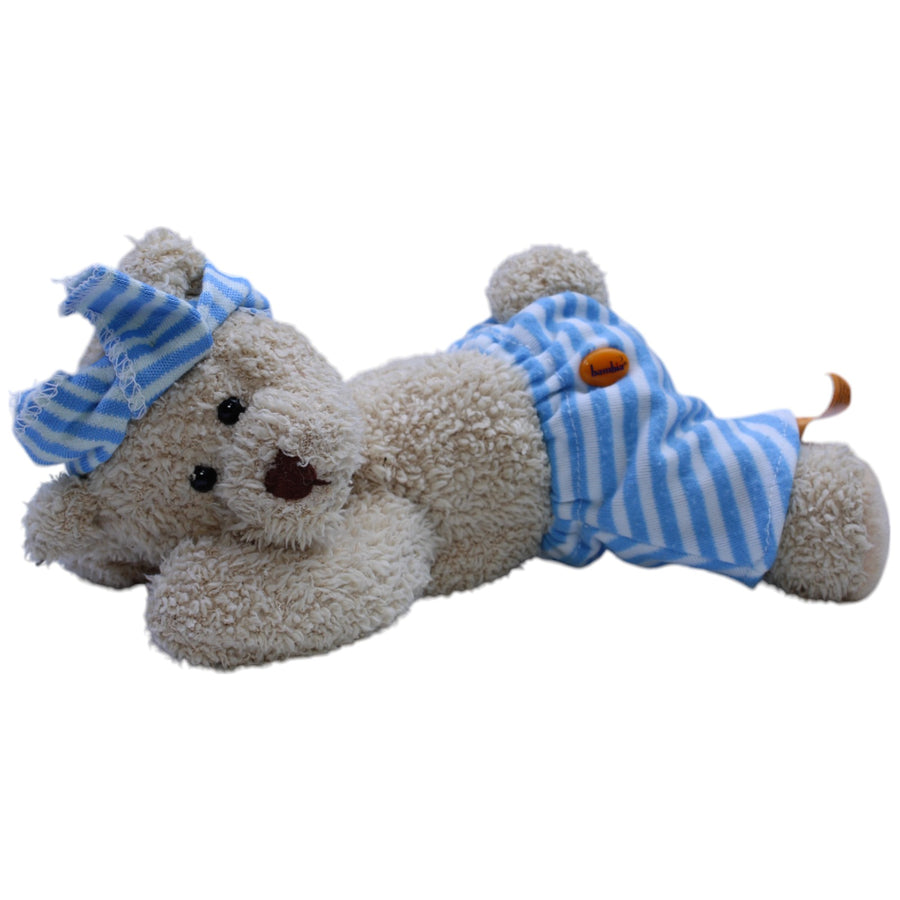 Teddybär mit blau gestreifter Hose und Stirnband, liegend