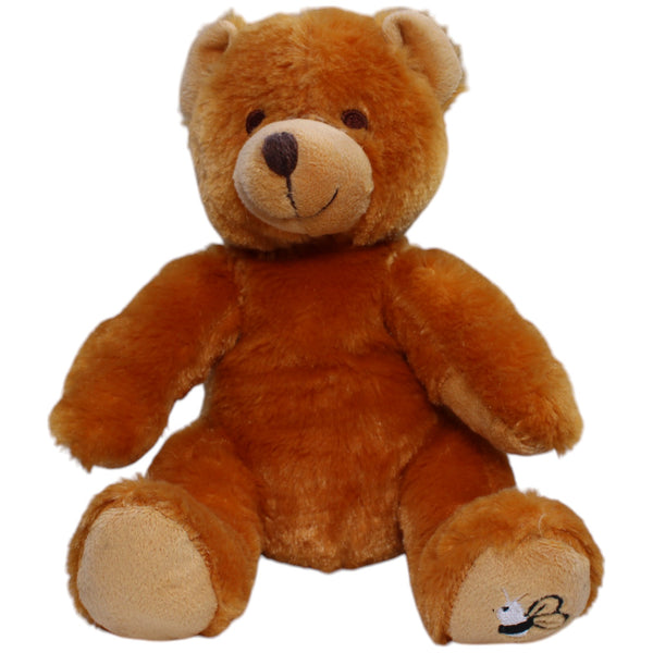 Teddybär mit Biene auf dem Fuß